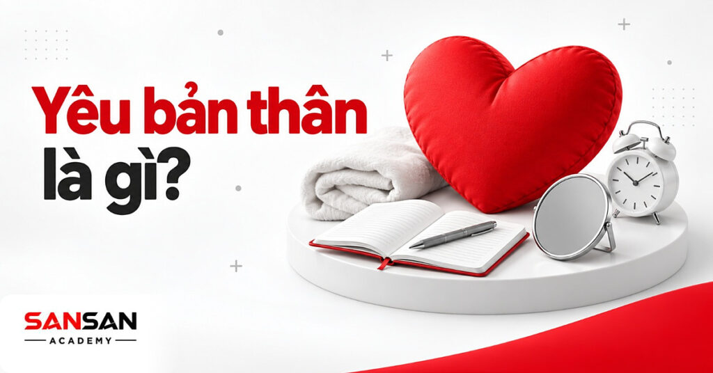 Gối trái tim đỏ trên bệ trắng cạnh chăn, sổ tay, đồng hồ và gương tròn minh họa yêu bản thân
